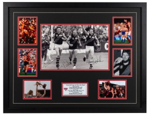 Framed photographic presentation titled "Farewell Lap at Waverley Park" featuring a photograph of Essendon greats Simon Madden, Tim Watson and Terry Daniher. CofA attached verso. 62 x 79cm overall.