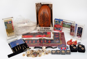AFL CENTENARY: Group lot of branded items many of which still in packaging, including Sherrin and Faulkner Centenary footballs, umpire's whistle, player's guernsey badge, forty-six pins, women's silk scarf, eight pens, wristwatch, and others. (60+ items)