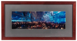 AFL CENTENARY BALL: Two panoramic photographs, one depicting the exterior of the large tent erected at the MCG for the event, the other depicting the interior with guests mingling, both framed and glazed, both 69 x 36.5cm overall. (2 items)