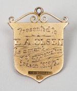 PORT ADELAIDE & SUBURBAN FOOTBALL ASSOCIATION,&nbsp;award medal in gold (9ct; 4.15g), by N.V.Rodgers, scroll and ring top suspension, obverse inscribed, 'P.A. & S.F. / Association.', reverse inscribed, 'Presented to / E.A.Olsen / As a mark / of appreciation / - 2