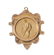 TOOAN EAST CRICKET CLUB,&nbsp;prize fob in gold (9ct; 3.50g), by Sace and Willis, ring top suspension, reverse inscribed, 'Mail Trophy / Won by / Tooan E. / 1910 / H.Holgate'.&nbsp;Very fine. H.Holgate was a bowler with the Tooan East cricket team. Tooan East is n