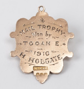 TOOAN EAST CRICKET CLUB,&nbsp;prize fob in gold (9ct; 3.50g), by Sace and Willis, ring top suspension, reverse inscribed, 'Mail Trophy / Won by / Tooan E. / 1910 / H.Holgate'.&nbsp;Very fine. H.Holgate was a bowler with the Tooan East cricket team. Tooan East is n - 2