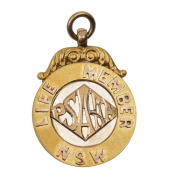 ATHLETICS:&nbsp;PUBLIC SCHOOLS AMATEUR ATHLETIC ASSOCIATION, Life Member NSW fob in gold (9ct; 8.6g; 24.5mm), by W. Kerr, scroll and ring top suspension, reverse inscribed, 'R.Browne./1934.'. Nearly uncirculated.