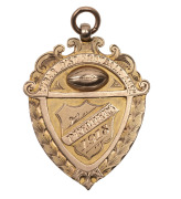 AUSTRALIAN RULES FOOTBALL AWARDS: Cobar District Football Association, prize fob in gold (9ct; 6.29g; 30x36mm), by W. Kerr, ring top suspension, obverse inscribed, 'Cobar Dist. Football Assn./Premiers/1918', reverse inscribed, 'Won by / Wrightville F.C. / - 2