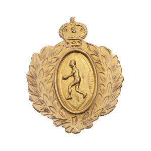 HINDMARSH SCHOOL, award fob in gold (9ct; 7.66g), ring at back for suspension, reverse inscribed, 'Hindmarsh / School / Fairest & most Brilliant / Player / 1949 / Won by / Malcolm Lewis / Presented by / R.R.Blight'. Extremely fine. Malcolm Lewis was in t