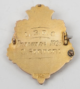 LAKE BOLAC FOOTBALL CLUB,&nbsp;prize fob in gold (9ct; 6.33g), by Dunklings, pin-back fitted, obverse inscribed, 'CS', reverse inscribed, 'L.B.F.C / Premiers 1925 / C.Sertori'.&nbsp;Very fine. Lake Bolac is a town in the Western District&nbsp;of Victoria. The Lake Bola - 2