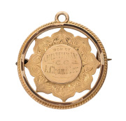 B.M.D. JUNIOR COMPETITION - CHELTENHAM CRICKET CLUB, prize medal in gold (15ct; 6.12g), pin-back and also ring top suspension, obverse inscribed, 'Won by / Cheltenham / C.C. / A.Chandler', reverse inscribed, 'The / B.M.D. Jr. Compt. / 1897-98. / The/Victo