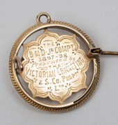 B.M.D. JUNIOR COMPETITION - CHELTENHAM CRICKET CLUB, prize medal in gold (15ct; 6.12g), pin-back and also ring top suspension, obverse inscribed, 'Won by / Cheltenham / C.C. / A.Chandler', reverse inscribed, 'The / B.M.D. Jr. Compt. / 1897-98. / The/Victo - 2