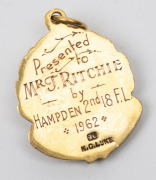VICTORIAN COUNTRY FOOTBALL LEAGUE, award fob in gold (9ct; 8.41g) ring top suspension, by K.G. Luke; the obverse inscribed "VCFL / RECOGNITION OF SERVICE"; the reverse engraved "Presented to / MR. J. RITCHIE / by / HAMPDEN 2nd 18 F.L. * 1962 * " - 2