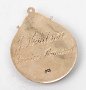 SOUTH MELBOURNE DISTRICT FOOTBALL CLUB, LIFE MEMBER'S fob in gold and enamel, (9ct; 4.36g) engraved on reverse "J. Hudson / Services Rendered"; circa 1955; very fine condition. - 2