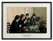 THE BEATLES IN AUSTRALIA, 1964: "The Beatles at their Press Conference Adelaide 1964", (John makes a point). Original colour print, signed by Vic Grimmett in the lower margin, 24.5 x 37cm, 35 x 46.5cm overall.