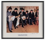 THE BEATLES IN AUSTRALIA, 1964: "Beatles admire some local gifts presented to them at S.A Hotel". Original colour print, signed by Vic Grimmett in the lower margin, 24.5 x 29.5cm, 35 x 39cm overall.