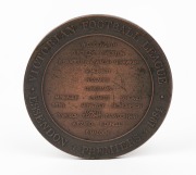 1984&nbsp;ESSENDON PREMIERSHIP MEDAL, with the front depicting a footballer by Andor Meszaros (1900-72, who had also designed 1956 Melbourne Olympics medals); the reverse showing the players names in their positions on the field, surrounded by text "Victorian - 2