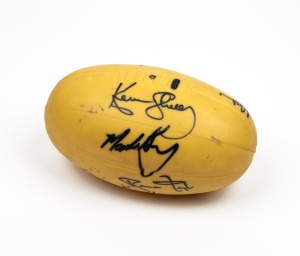 A souvenir rubber "SKILBALL" football signed at a charity event, circa 1985 by Terry Daniher, Ricky Kennedy, Kevin Sheedy, Kevin Bartlett, Lorenzo 'Laurie' Serafini and several others.