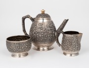 GRISH CHANDER DUTT fine quality antique Indian silver three piece tea service with impressive repousse decoration and ivory finial, 19th/20th century, stamped "GRISH CHANDER, BHOWANIPORE, CALCUTTA", the teapot 14cm high, 660 grams total. - 2