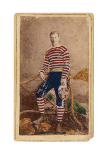 SOUTH MELBOURNE: circa 1880 hand-coloured carte-de-visite-size albumen paper photograph of a footballer in South Melbourne colours, the image taken by E. Pollard & Co., Artist Photographers of Lygon Street, Carlton. Extremely scarce.