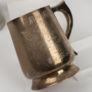 Three pewter tankards presented to Barry Round - one inscribed "To Barry Round for 200 VFL Games From Trainers & Staff South Melbourne Football Club", one with floral motif inscribed "To Barry Round - 250 Games - From The Bloods", and one inscribed "Congr - 2