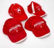 Group of four of Barry Round's Sydney Swans caps, comprising two Sydney Swans Premiers 2005, and two plain Sydney Swans.