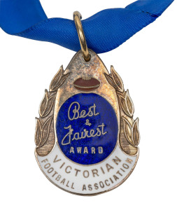 J.J. LISTON TROPHY: Barry Round's 1987 medal with text 'Best & Fairest Award - Victorian Football Association' and engraving on reverse 'J.J. Liston Best & Fairest 1st Division Won By Barry Round 1987'. Round is one of only three players ever to have won both the Liston and the Brownlow (the other two being Des Fothergill and Sam Mitchell).