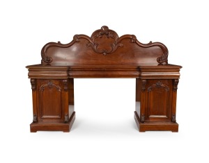 GEORGE THWAITES (attributed) antique Australian cedar twin pedestal sideboard with acanthus scroll carved back panel above three long ogee moulded drawers, the central fitted with six cutlery drawers, the pedestals with panelled doors and corbel decoration, Melbourne origin, circa 1880, 166cm high, 227cm wide, 63cm deep