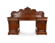 GEORGE THWAITES (attributed) antique Australian cedar twin pedestal sideboard with acanthus scroll carved back panel above three long ogee moulded drawers, the central fitted with six cutlery drawers, the pedestals with panelled doors and corbel decoratio