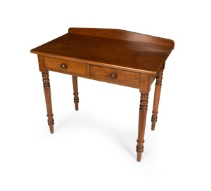 A rare antique Australian Colonial rose mahogany two drawer hall table with low paladian back and turned tapered legs, New South Wales origin, circa 1835, 85cm high, 92cm wide, 53cm deep