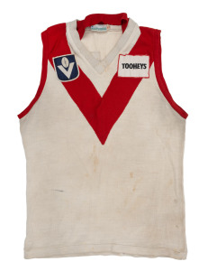 Barry Round's match-worn 1985 Sydney Swans VFL guernsey, Tooheys branding on front, number 25 on back. After 193 games, 157 goals, and four full seasons as captain, Round concluded his time with the Swans, and with the League more broadly, with a move bac