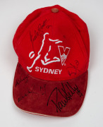 Three Sydney Swans caps, one with five original player signatures including Paul Kelly, and one with original signature of Barry Hall, together with three G.C. Suns caps. - 2