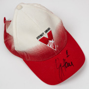 Three Sydney Swans caps, one with five original player signatures including Paul Kelly, and one with original signature of Barry Hall, together with three G.C. Suns caps. - 3