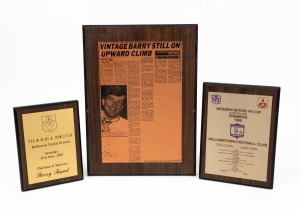 Three of Barry Round's commemorative plaques - 1986 'Mitsubishi Motors VFA Cup Division One Premiers - Williamstown Football Club', 1987 'Vintage Barry Still on Upward Climb' news article reporting on Round's Liston Trophy win, and 'VFA 16.15.111 d. NSW 2