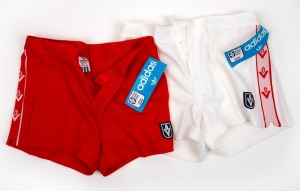 Pair of Barry Round's unworn red Adidas VFL Swans home-game shorts, together with his pair of unworn white Adidas VFL Swans away-game shorts, c. 1980.