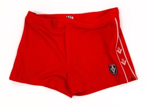 Pair of Barry Round's red Adidas VFL Swans home-game shorts with 'ROUND' inscription on tag in permanent marker, c. 1981.