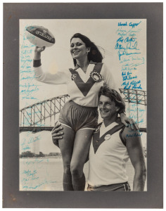 1984 black and white photograph of Barry Round with female Swans enthusiast and Harbour Bridge in background, featuring more than forty original signatures of Swans players including Pat Foy, Barry Mitchell, Craig Potter, Warwick Capper, Wayne Carroll, St