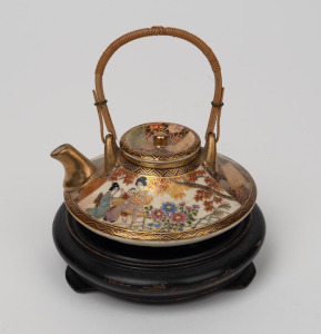 SATSUMA antique Japanese earthenware teapot with rattan handle, with turned timber stand, Meiji Period, 19th/20th century, 9cm high including handle, 12cm high overall.