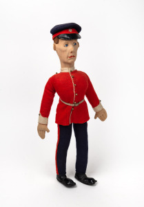 A vintage military doll in felt costume, mid 20th century, 50cm high