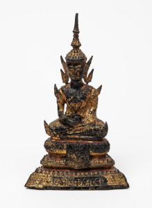 An antique cast bronze seated Buddha statue with remains of gilt finish, Thai or Burmese, 19th/20th century, 20cm high