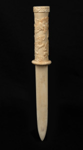 A carved marine ivory paperknife adorned with angels and cherubs, 20th century, ​​​​​​​24cm long