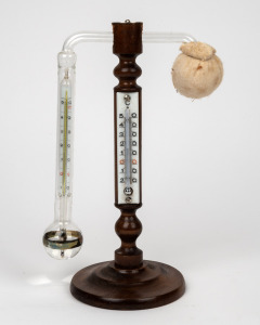 DANIELS antique hygrometer on turned beech stand with alcohol dry thermometer, mercury thermometer with spirit sleeve and wet bulb, early 20th century, new old stock in original box of issue. 26cm high.