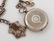 A antique silver cased open faced pocket watch on an antique sterling silver Albert fob chain and a silver and enamel fob inscribed "BIRMINGHAM & DIST. WORKS AMATEUR F'BALL ASSOC'N", 19th century, the chain 37cm long. - 2