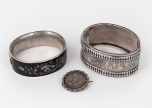 An antique English sterling silver brooch with gold highlights; together with an antique sterling silver bangle with gold highlights and an antique sterling silver bracelet with enamel and seed pearl decoration, 19th century, (3 items)