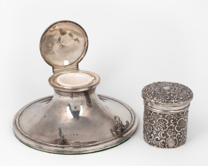 A sterling silver inkwell desk piece with porcelain liner and weighted base; together with a sterling silver lidded jar with repousse decoration, 19th/20th century, (2 items), the inkwell 20cm diameter, the jar 103 grams
