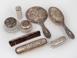 Antique English "Chorus of Angels" sterling silver vanity ware, including brushes, jars, bottles and comb, (8 items)