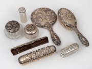 Antique English "Chorus of Angels" sterling silver vanity ware, including brushes, jars, bottles and comb, (8 items)