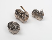 A Chinese opium pipe; together with three zoomorphic silver finish boxes, 20th century, (4 items), the pipe 58cm long - 3