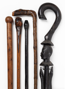 Five assorted walking sticks, including carved tribal examples. Irish blackthorn and English yew, 19th and 20th century, the longest 96cm high