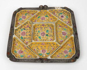 An antique Chinese porcelain savoury dish set with yellow ground in original pewter and polished stones surround, Qing Dynasty, 19th/20th century, 29cm wide.