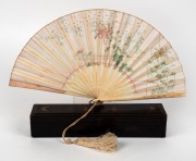 An antique Chinese carved ivory and hand-painted silk fan, housed in original box, 19th century, the box 29cm wide.