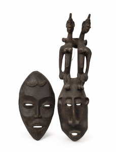 Two tribal masks, carved wood with dark patination, African origin, ​​​​​​​99cm and 51cm high.