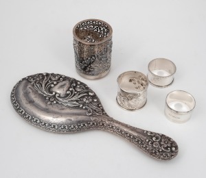 Three assorted sterling silver napkin rings, sterling silver hand mirror and a sterling silver vanity jar, 19th/20th century, (5 items), 175 grams not including the mirror.