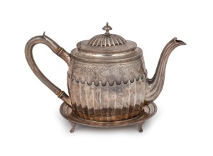 A Georgian sterling silver teapot with engraved and gadrooned decoration on matching trivet, made in London, circa 1797, (2 items), 16cm high overall, 28cm wide, 795 grams total